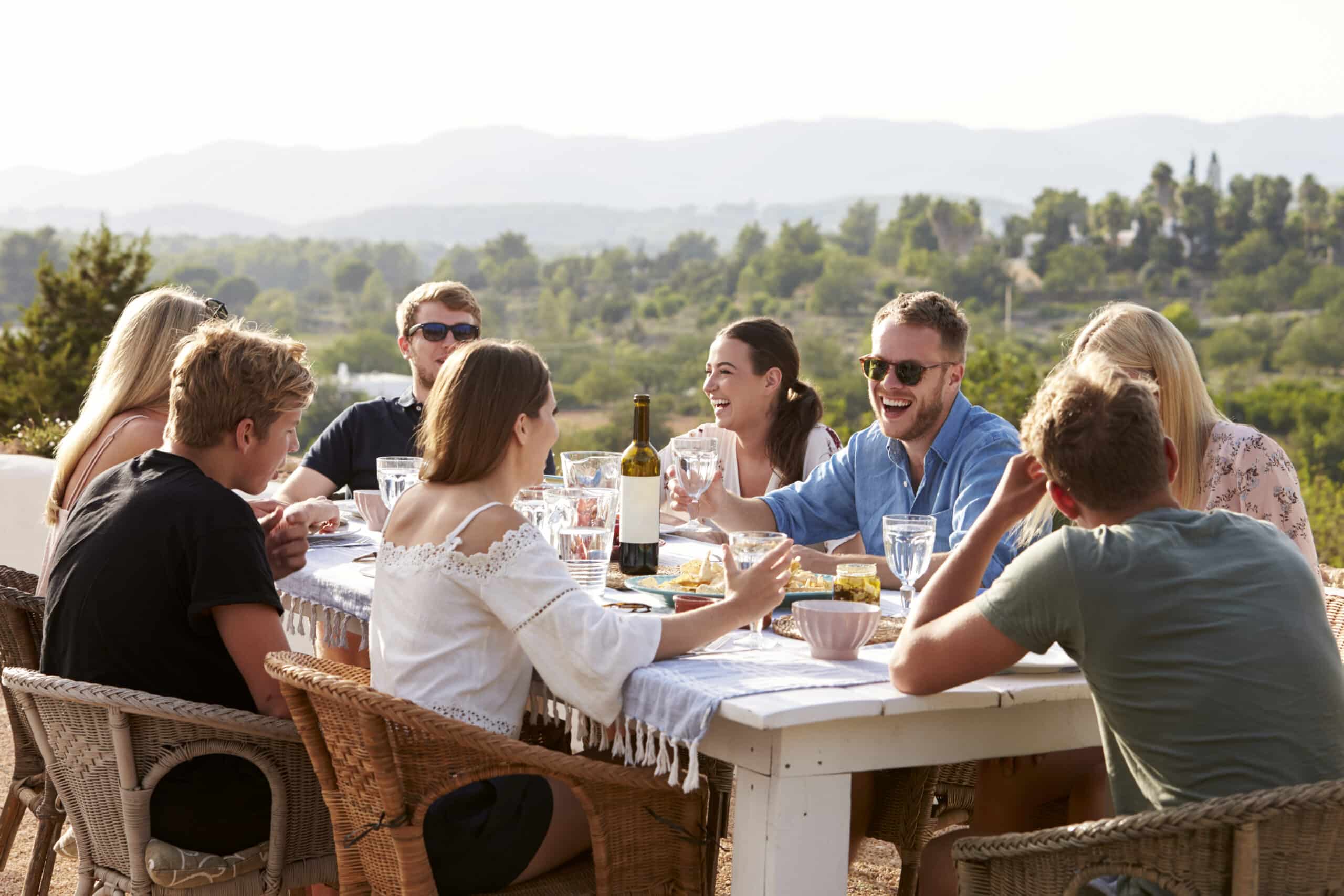 Group Of Young Friends Enjoying Outdoor Meal On Holiday